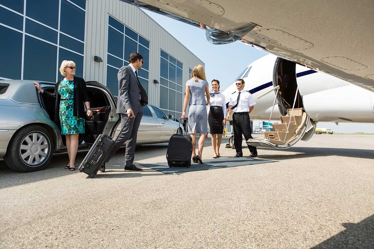 Executive boarding a private jet for business travel